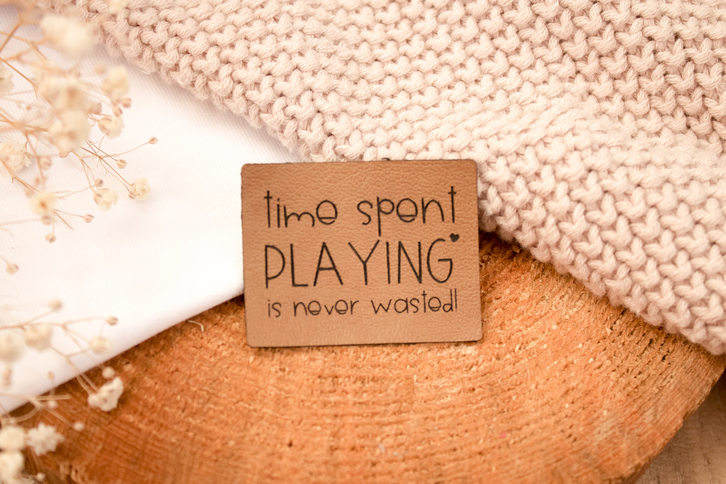Kunstleder-Label "Time spent playing is never wasted!"